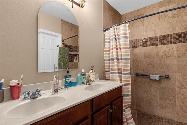 bathroom with a shower with curtain and vanity