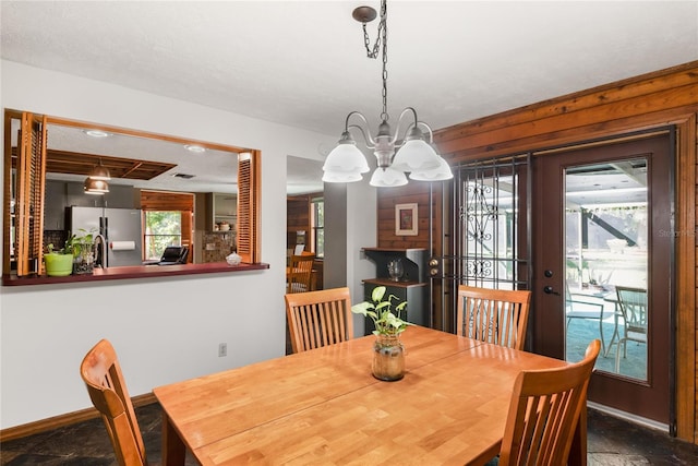 dining space featuring an inviting chandelier