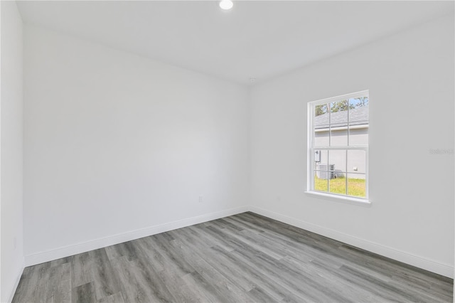 spare room featuring light wood-type flooring