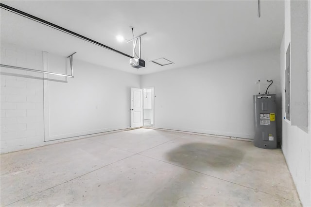 garage featuring electric water heater and a garage door opener