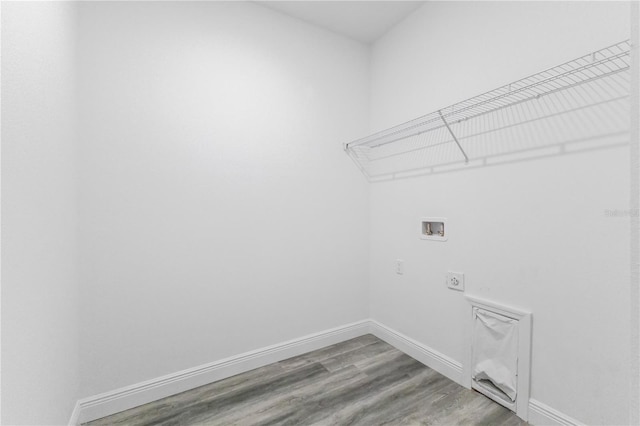 laundry area featuring hookup for an electric dryer, hookup for a washing machine, and hardwood / wood-style flooring