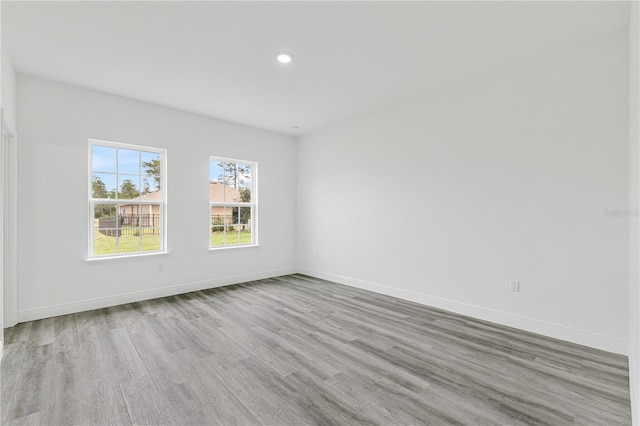 unfurnished room with light hardwood / wood-style flooring