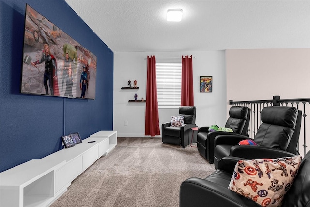 living room featuring carpet floors and a textured ceiling