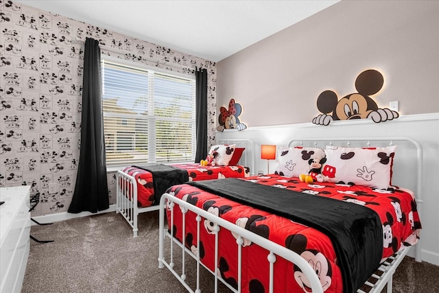 bedroom with dark colored carpet