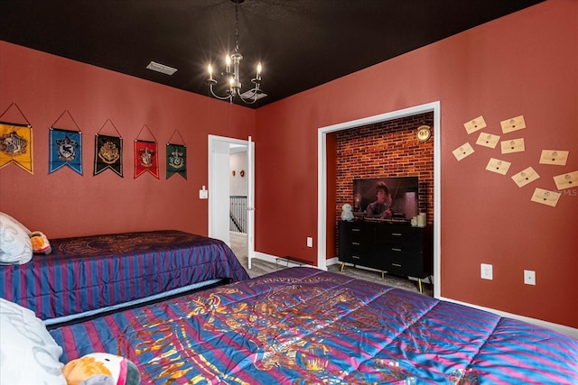 bedroom with carpet flooring and a chandelier