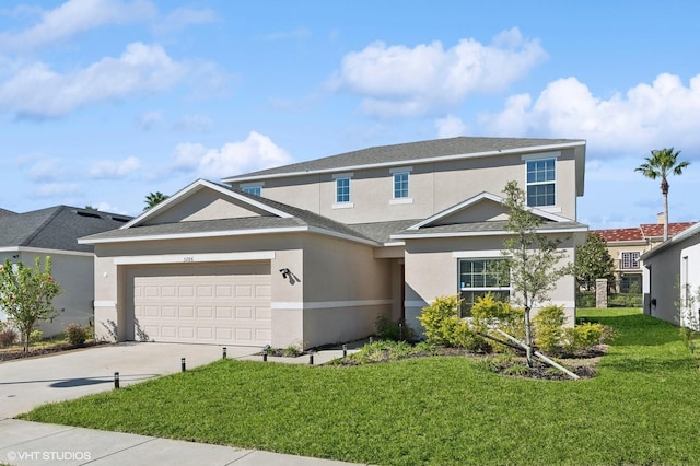 front of property with a front lawn and a garage