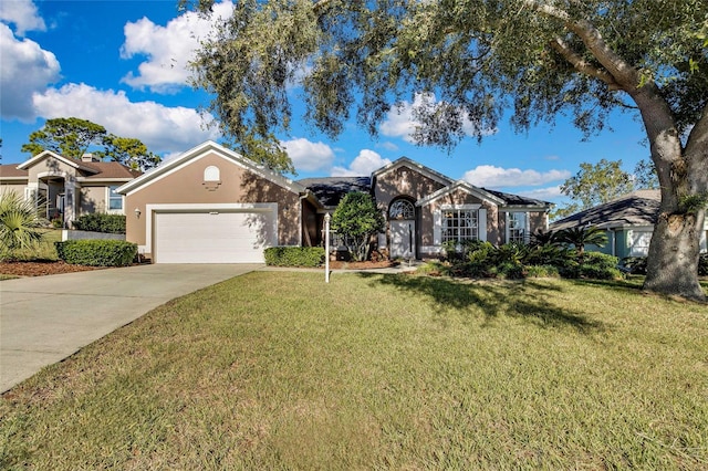 view of front of home featuring a garage and a front lawn