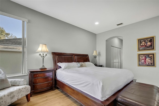 bedroom featuring a closet and light hardwood / wood-style flooring