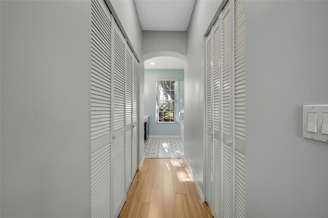 corridor featuring light wood-type flooring