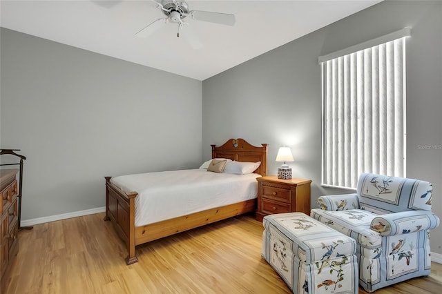 bedroom with ceiling fan and light wood-type flooring