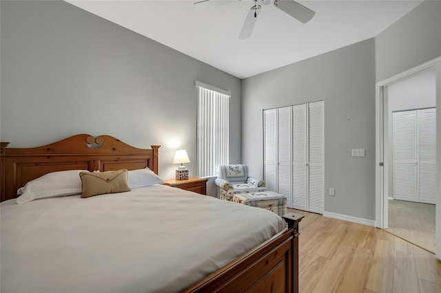 bedroom with ceiling fan and light hardwood / wood-style flooring