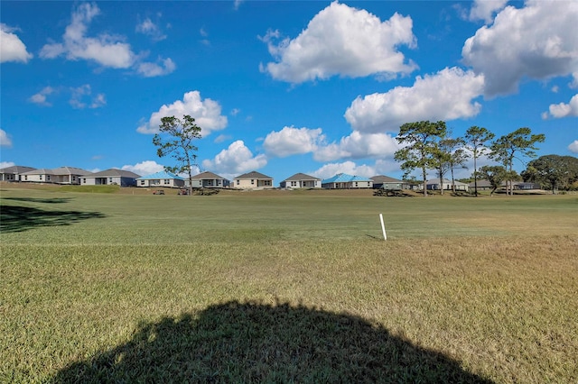 surrounding community featuring a lawn