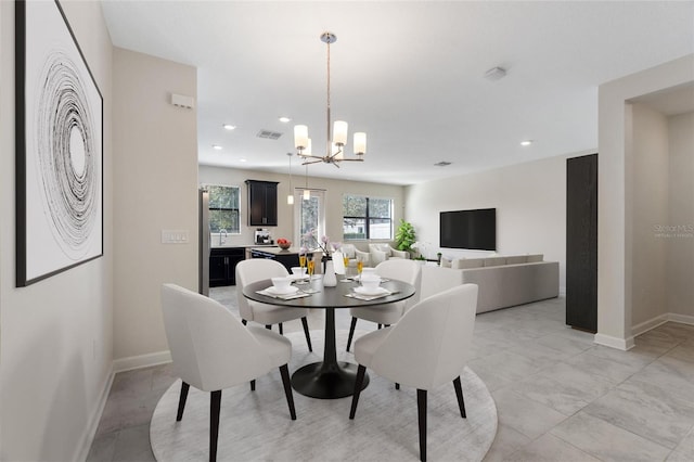 dining space featuring a chandelier