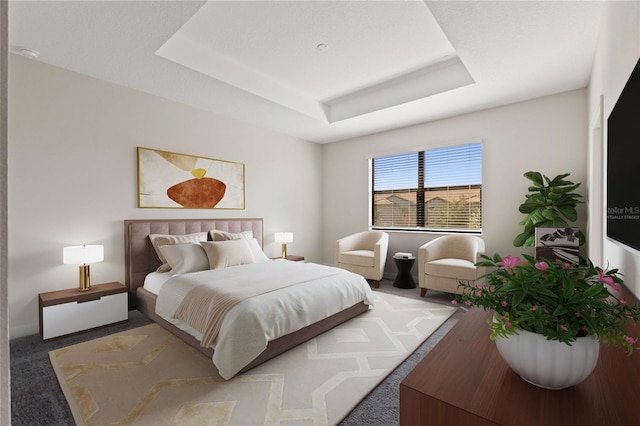 carpeted bedroom featuring a raised ceiling