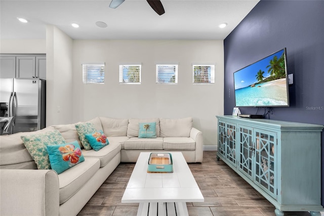 living room featuring ceiling fan and hardwood / wood-style floors