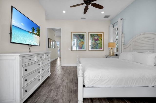 bedroom featuring multiple windows, ceiling fan, and dark hardwood / wood-style flooring