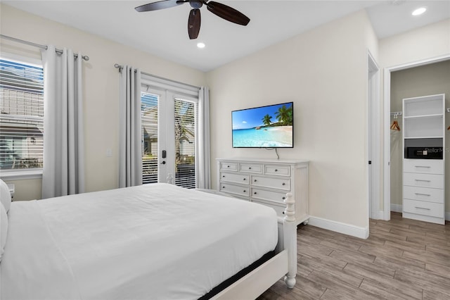 bedroom with access to outside, ceiling fan, and light wood-type flooring