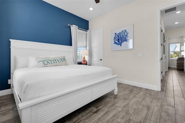 bedroom featuring hardwood / wood-style floors and ceiling fan