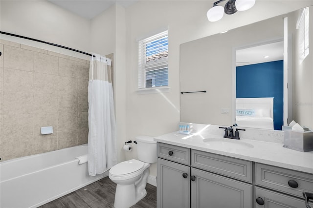 full bathroom featuring shower / tub combo, vanity, hardwood / wood-style flooring, and toilet