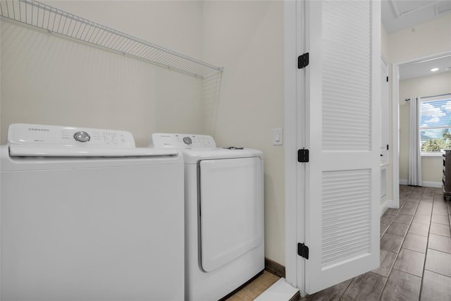 laundry area with independent washer and dryer