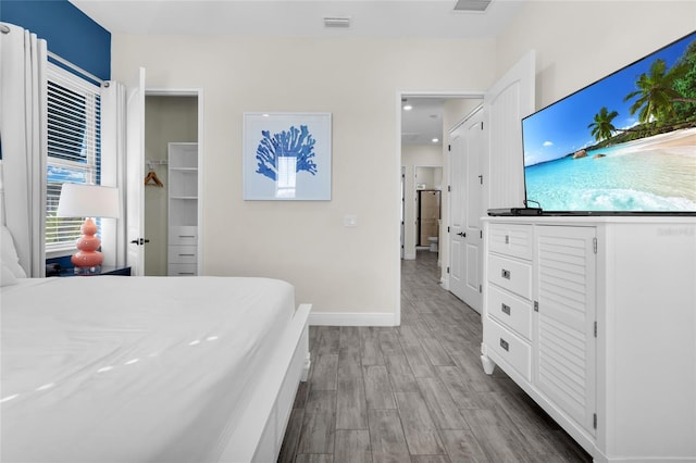 bedroom with light wood-type flooring