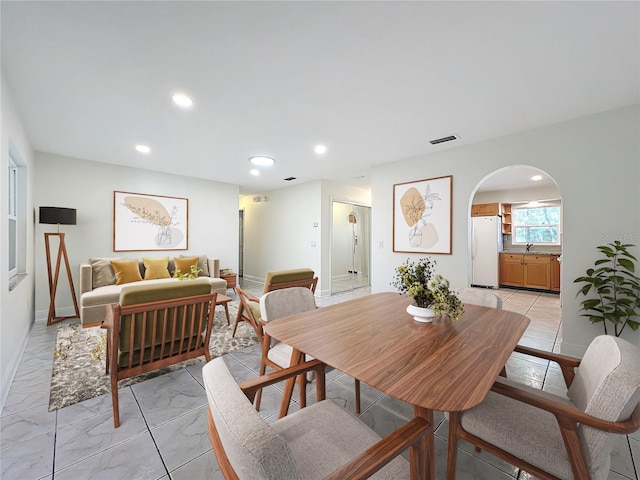 dining room featuring sink