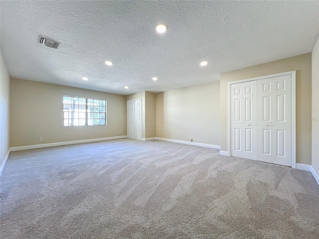 interior space featuring a textured ceiling