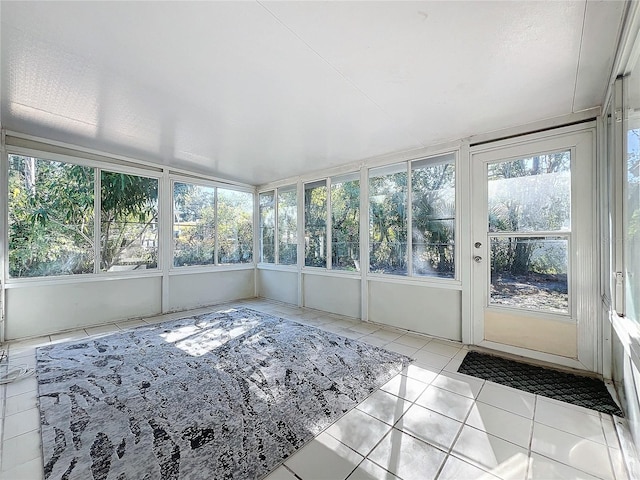 unfurnished sunroom featuring plenty of natural light