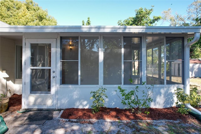 exterior space featuring a sunroom