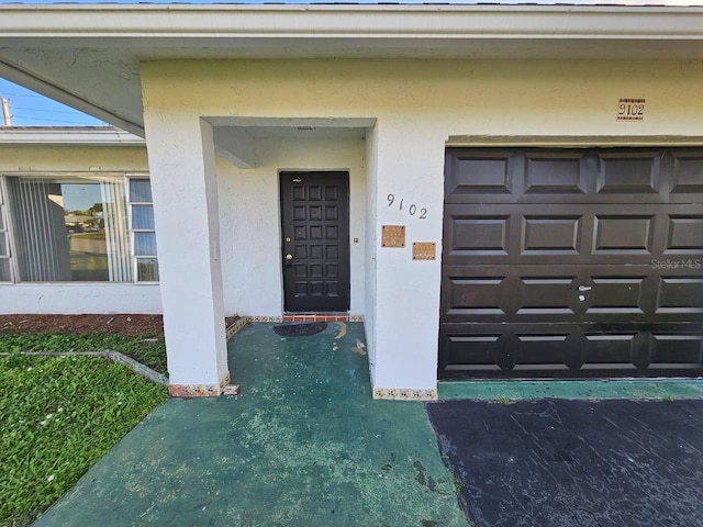 property entrance with a garage