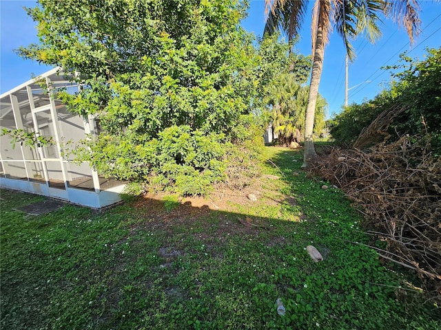 view of yard featuring a sunroom