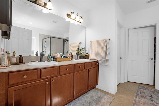 1651 Kingfisher Ct, Kissimmee, FL 34746 - bathroom featuring double vanity, a shower stall, and tile patterned floors