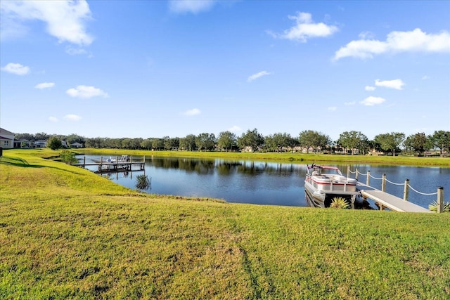 1651 Kingfisher Ct, Kissimmee, FL 34746 - dock area featuring a water view and a lawn
