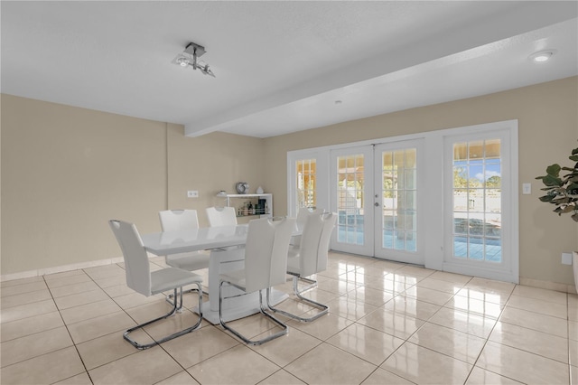 tiled dining area with french doors and beam ceiling