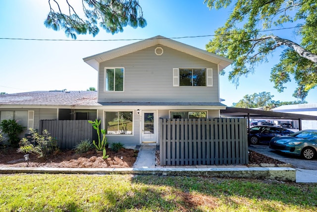 view of front property featuring a carport