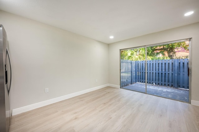 unfurnished room featuring light hardwood / wood-style floors