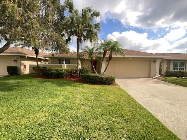 ranch-style house with a front yard and a garage