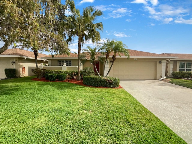 single story home with a garage and a front lawn