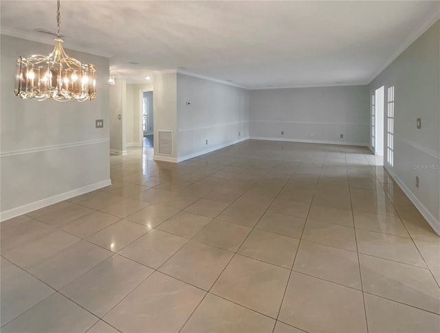 tiled spare room featuring a chandelier and ornamental molding