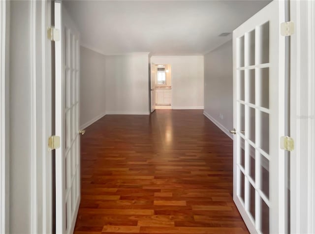 empty room with dark hardwood / wood-style floors