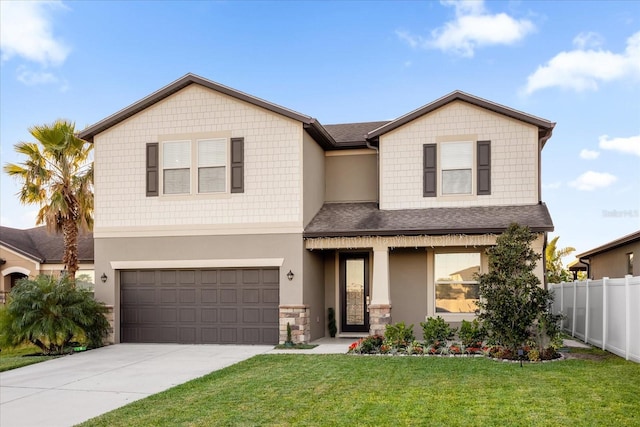 view of front of house featuring a garage and a front lawn