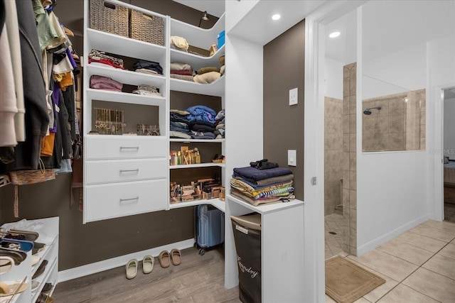 spacious closet featuring light tile patterned flooring