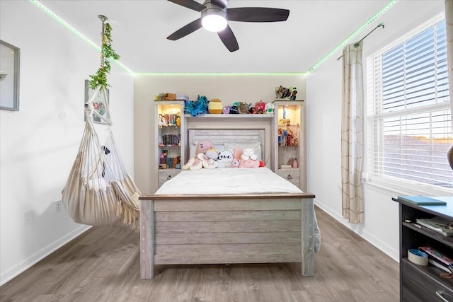 bedroom featuring ceiling fan and hardwood / wood-style flooring