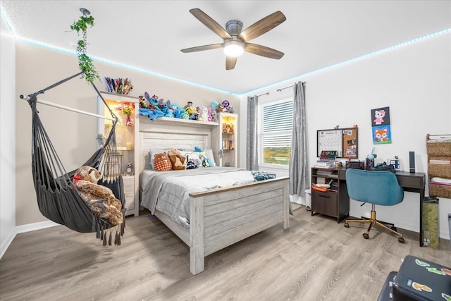 bedroom featuring ceiling fan and light hardwood / wood-style floors