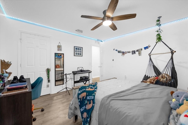 bedroom with ceiling fan and hardwood / wood-style flooring