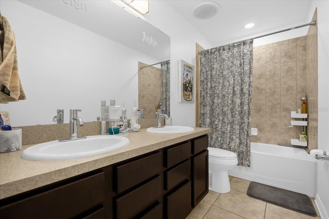 full bathroom featuring tile patterned floors, vanity, toilet, and shower / bath combo