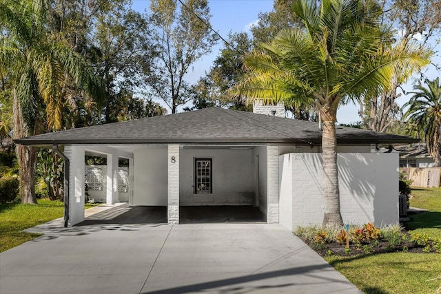 view of front of home featuring a carport