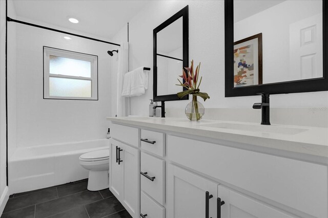 full bathroom with tile patterned flooring, vanity, shower / bathtub combination, and toilet