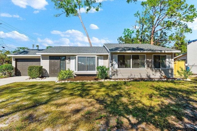 single story home with a front lawn and a garage