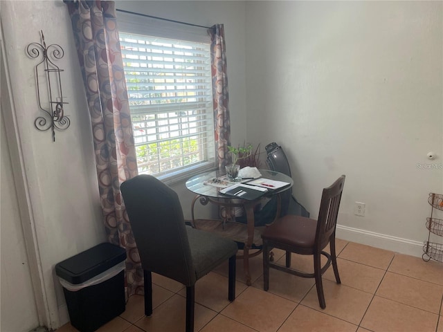 dining area with light tile patterned floors